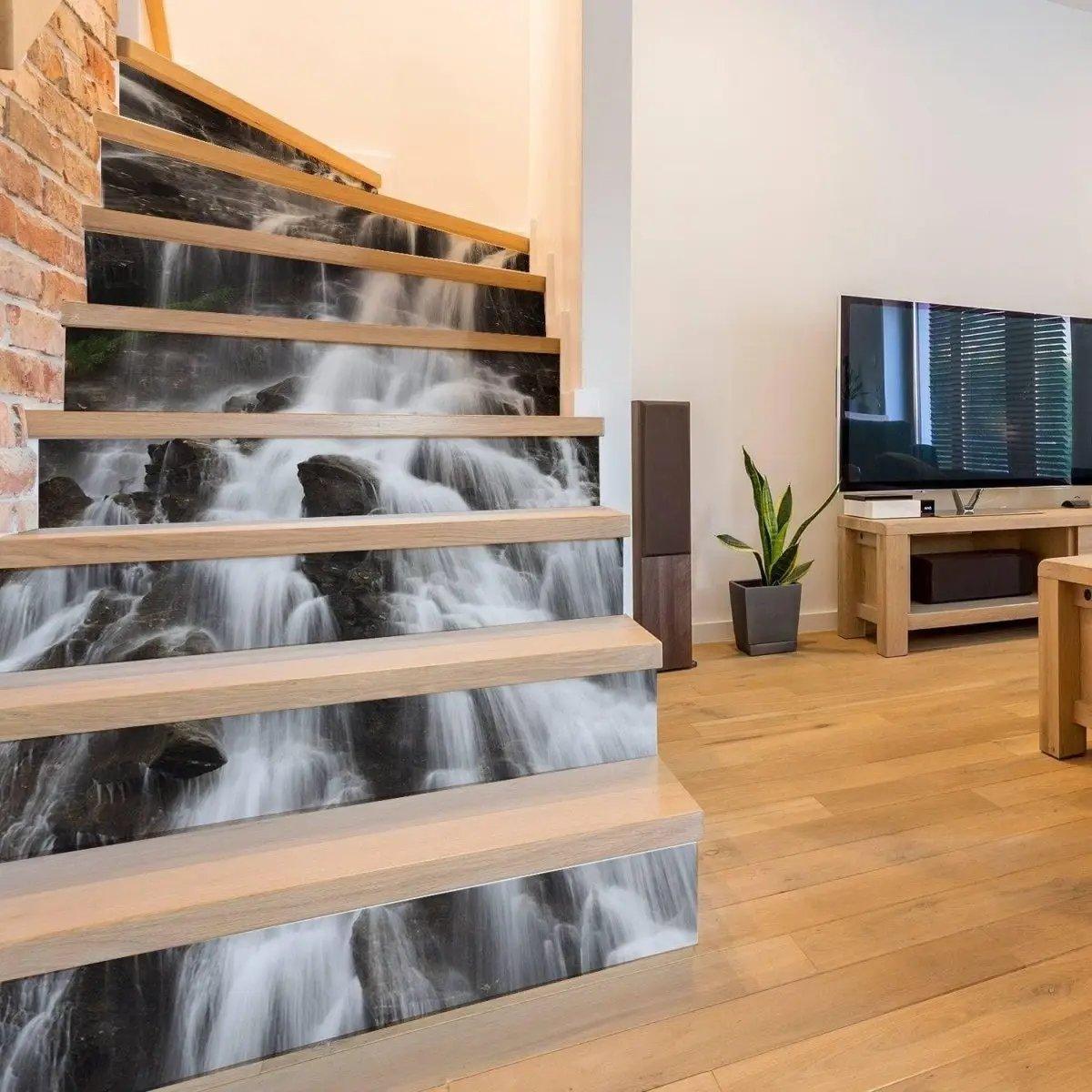 Creative staircase vinyl sticker decals featuring a waterfall design on wooden stairs for home decor inspiration.