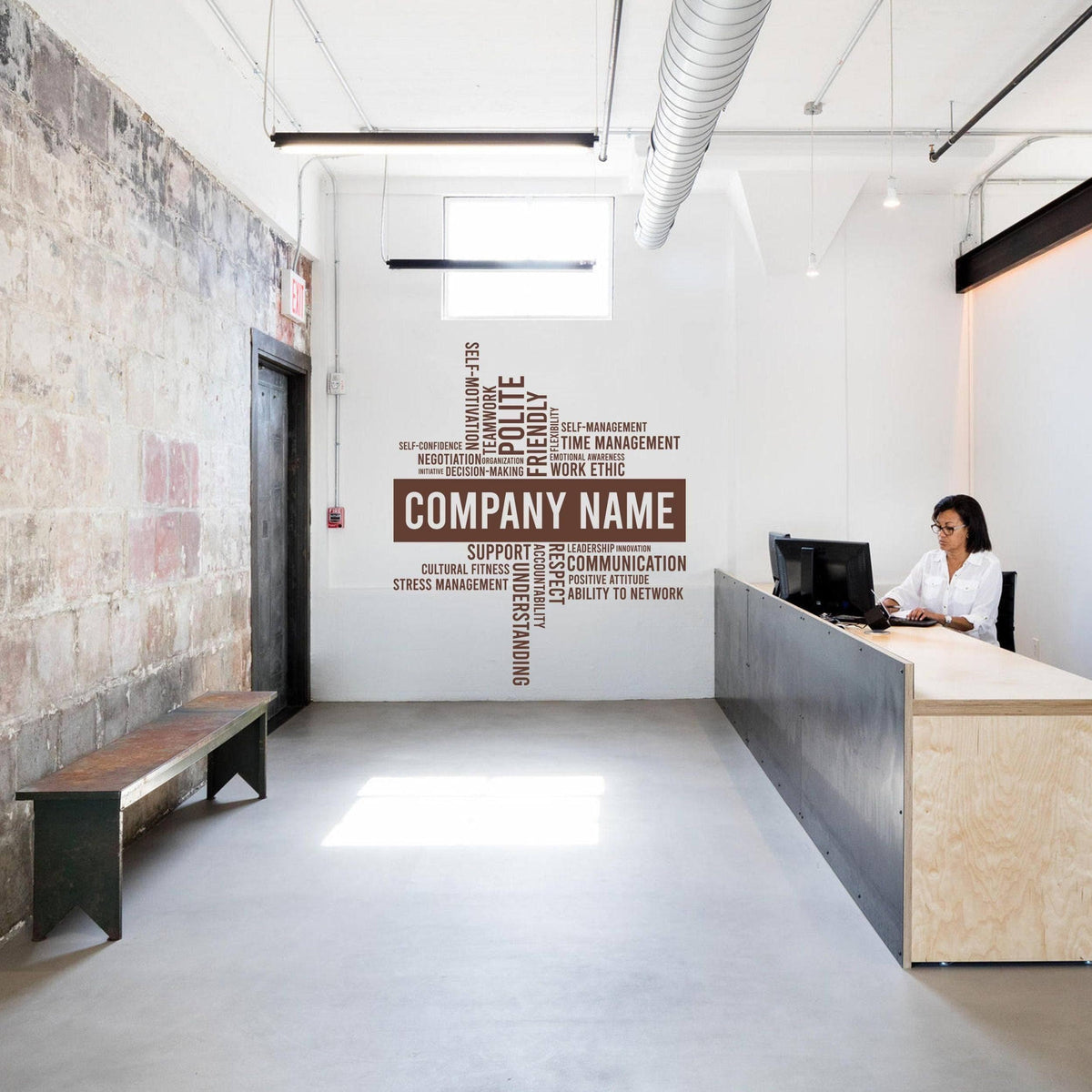 Modern office space featuring a personalized wall decal with 'Company Name' and motivational words.