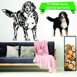 Customizable pet illustration decal on a living room wall next to a photo of a dog, showcasing personalized wall art.