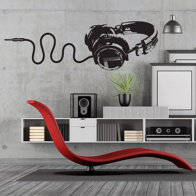 Decorative vinyl wall decal of headphones for music lovers.