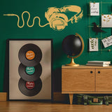 Decorative vinyl wall decal of headphones on a green wall, showcasing musical design for music lovers.