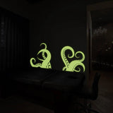 Glow-in-the-dark octopus tentacle wall stickers illuminating a dark room, adding oceanic decor to your space.