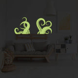 Glowing octopus tentacle wall decals in a cozy living room.