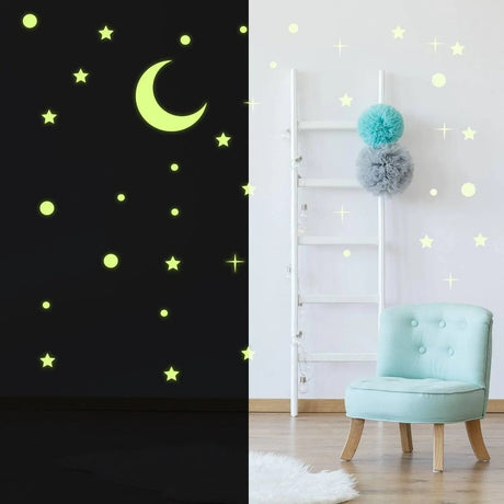 Glow in the dark star and moon stickers on a wall, luminescent ceiling decor for a magical night sky effect.