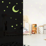 Glow in the dark star and moon stickers on a child's ceiling, creating a captivating night sky effect.