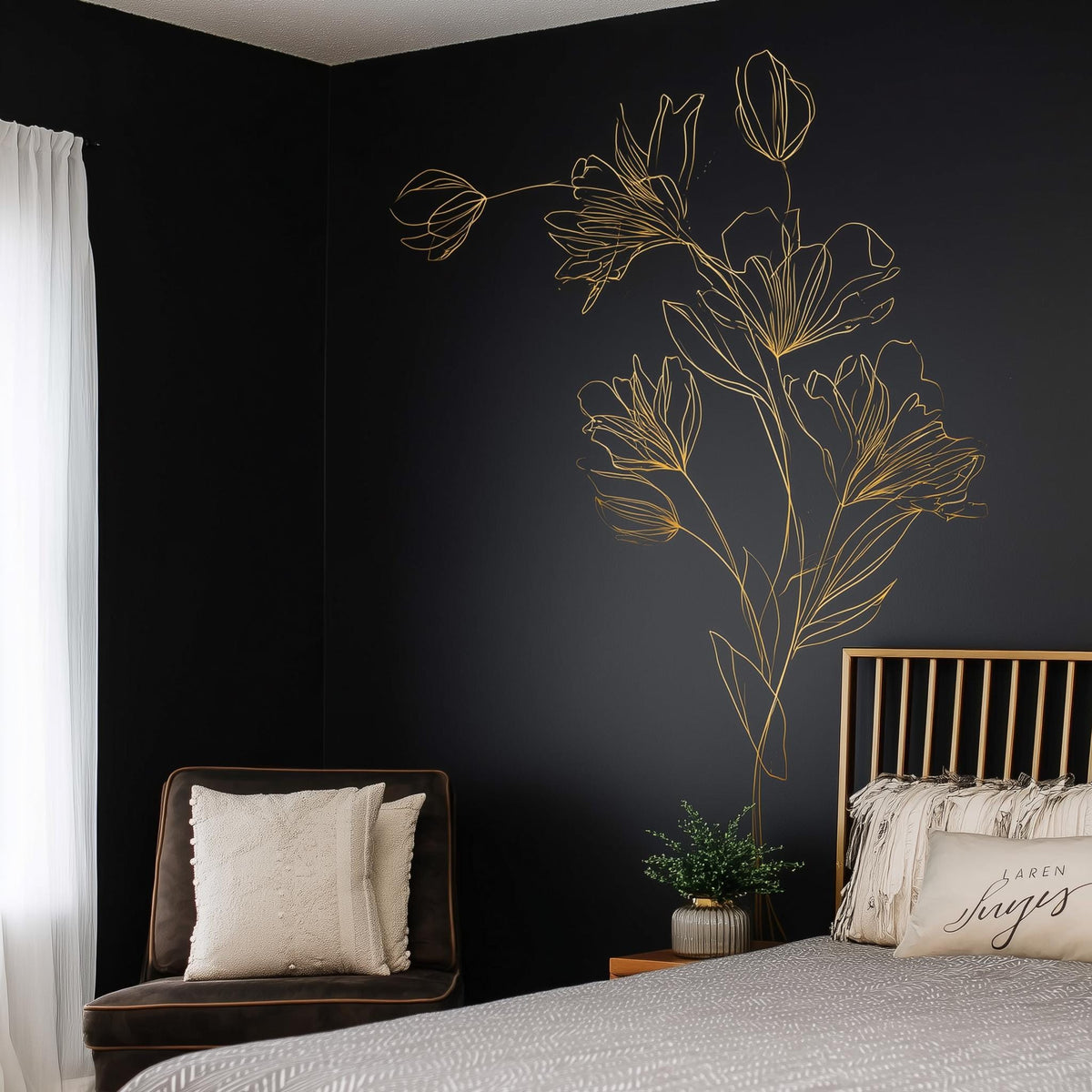 Gold floral line art wall decal in minimalist bedroom, adding elegance to dark wall and modern decor.