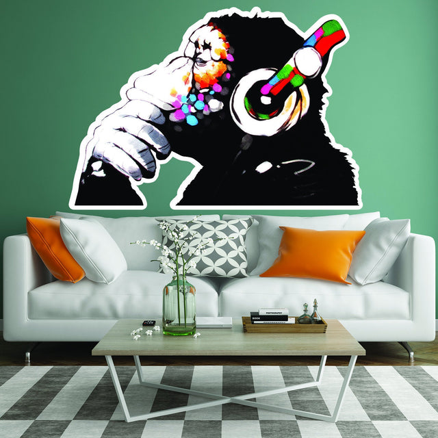 Thinking monkey in headphones wall decal shown in a product image.