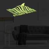 Printed vinyl decal artwork showing a swimming fish design