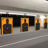 Full-length silhouette practice target poster shown at room scale.