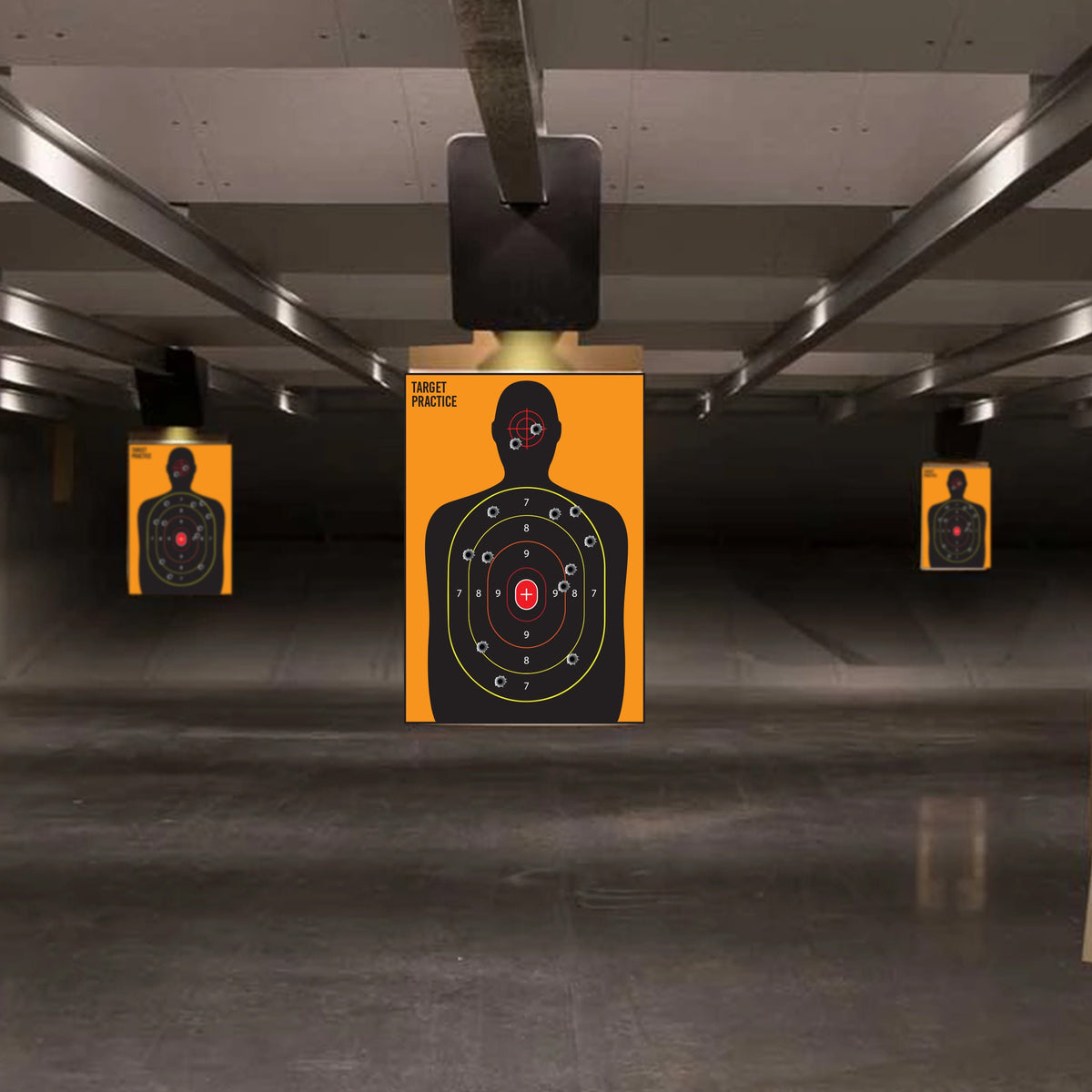 Multiple full-length silhouette scoring target posters displayed in a practice area.