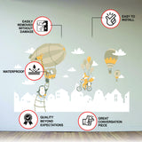 Printed vinyl decal artwork showing penguins, a fox, balloons and cloud elements