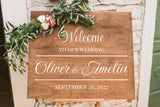 Black personalized wedding sign decal shown in a modern ceremony setting.