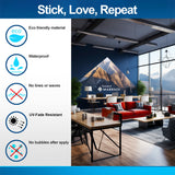 Wall vinyl sticker benefits infographic beside a mountain mural in a modern office, with illustrated durability features.