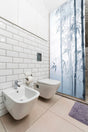 Tranquil Bamboo Forest Shower Glass Door Sticker applied to a window.