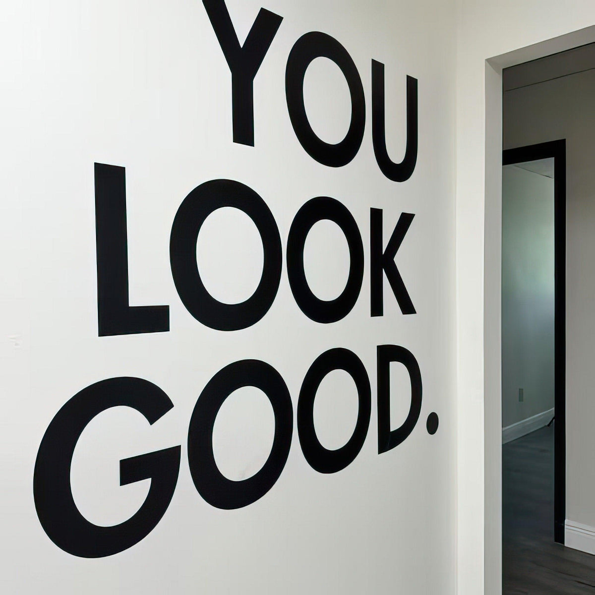 You Look Good vinyl wall sticker in bold black letters, enhancing decor in an entryway or hallway.