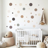 Printed vinyl decal artwork showing separate beige, taupe and grey circle wall decals in several small sizes