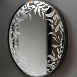 Custom frosted vinyl floral design on a round mirror, creating an etched glass effect.