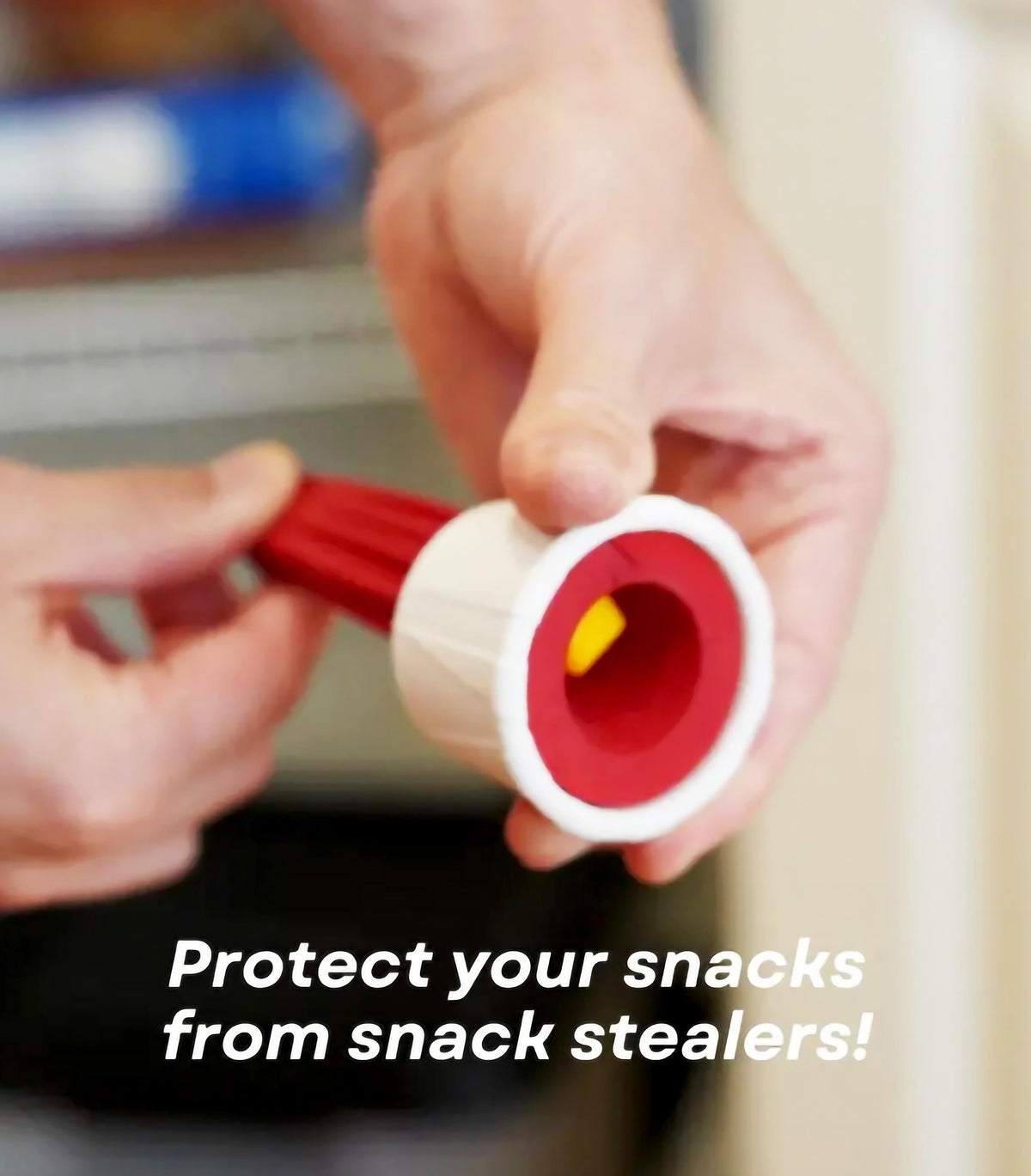 Hands holding a Ketchup Cannon snack sealer, emphasizing fun snack protection against snack thieves.