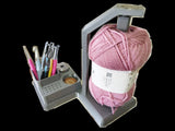 3D printed crochet tools organizer with pink yarn and hooks, enhancing your crocheting experience.