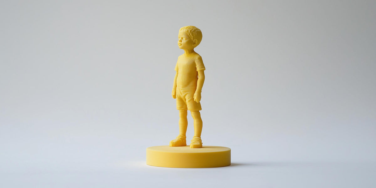 Custom PLA figure with sculpted details produced through additive 3D printing