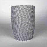 3D printed gray zigzag planter cover with a modern design for indoor plants, enhancing home decor.
