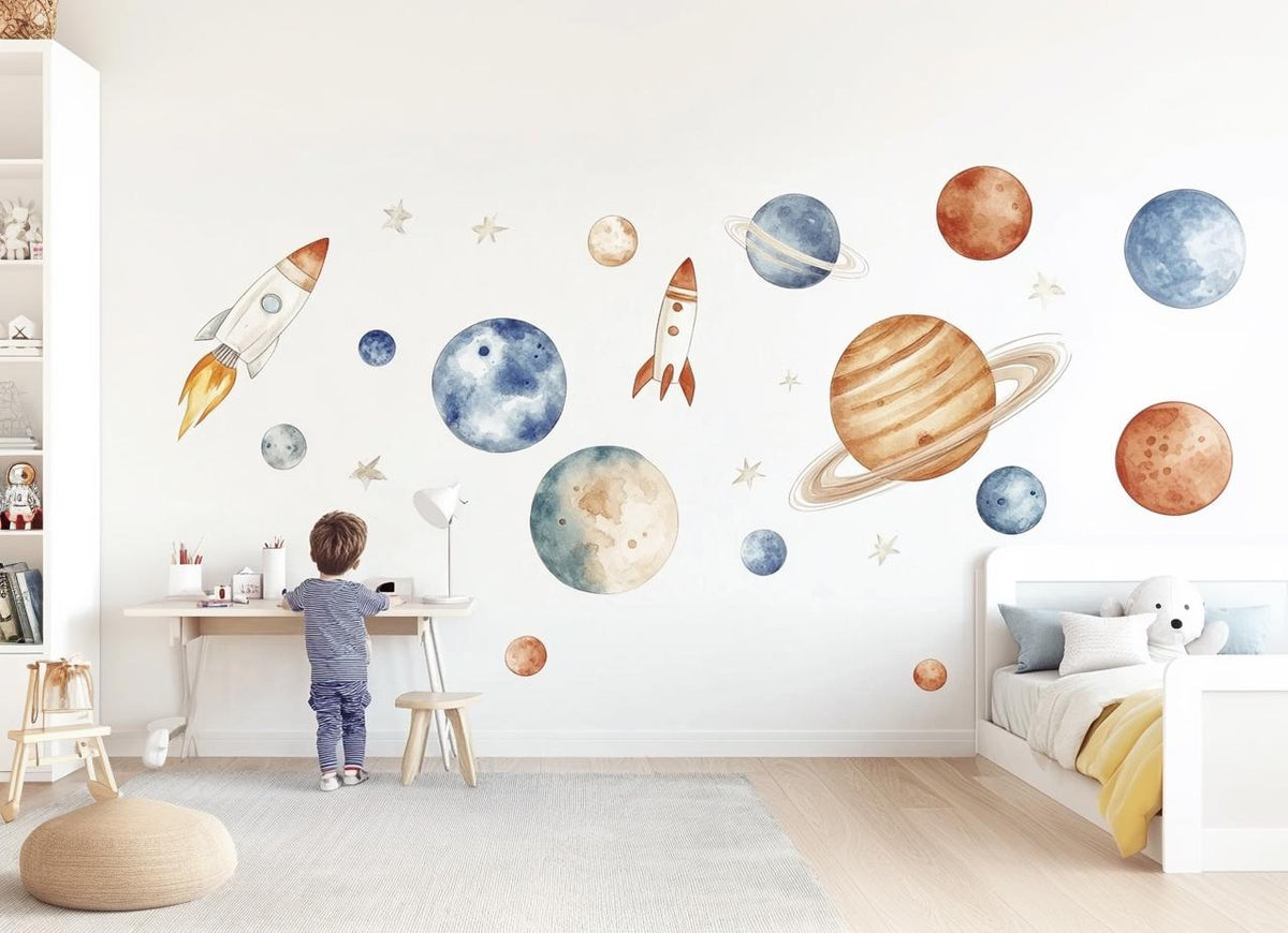 Watercolor Space Wall Decals featuring watercolor space themed decals, including rockets, planets, and stars in blue