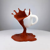 Coffee Splash Illusion Sculpture featuring cup suspended above a sculpted coffee stream