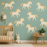 Unicorn Wall Decals featuring twelve pastel unicorn decals with golden manes and horns arranged over a teal background