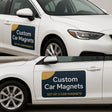 2x Custom Car Magnet shown on a vehicle.