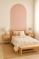 Modern arch wall decal in a nursery, enhancing the bed backdrop with a minimalist design and soft pink tone.