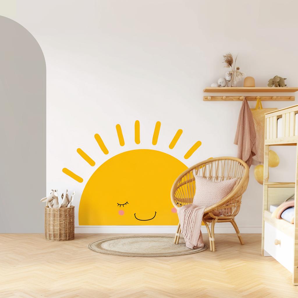 Bright smiling half sun wall decal in a nursery with cozy decor and furniture.