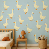 Goose Wall Decals featuring twelve large cream colored goose decals, arranged evenly on a soft blue wall