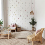 Printed vinyl wall artwork showing individual pastel watercolor wildflowers for a nursery wall