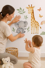 Jungle Animal Wall Decals for Nursery featuring an elephant, giraffe and jungle botanical leaves