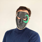 Black Full Face Cosplay Mask featuring green crescent design around one eye