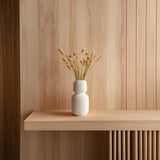 Stacked Geometric Vase featuring ribbed texture, holding dried grass stems
