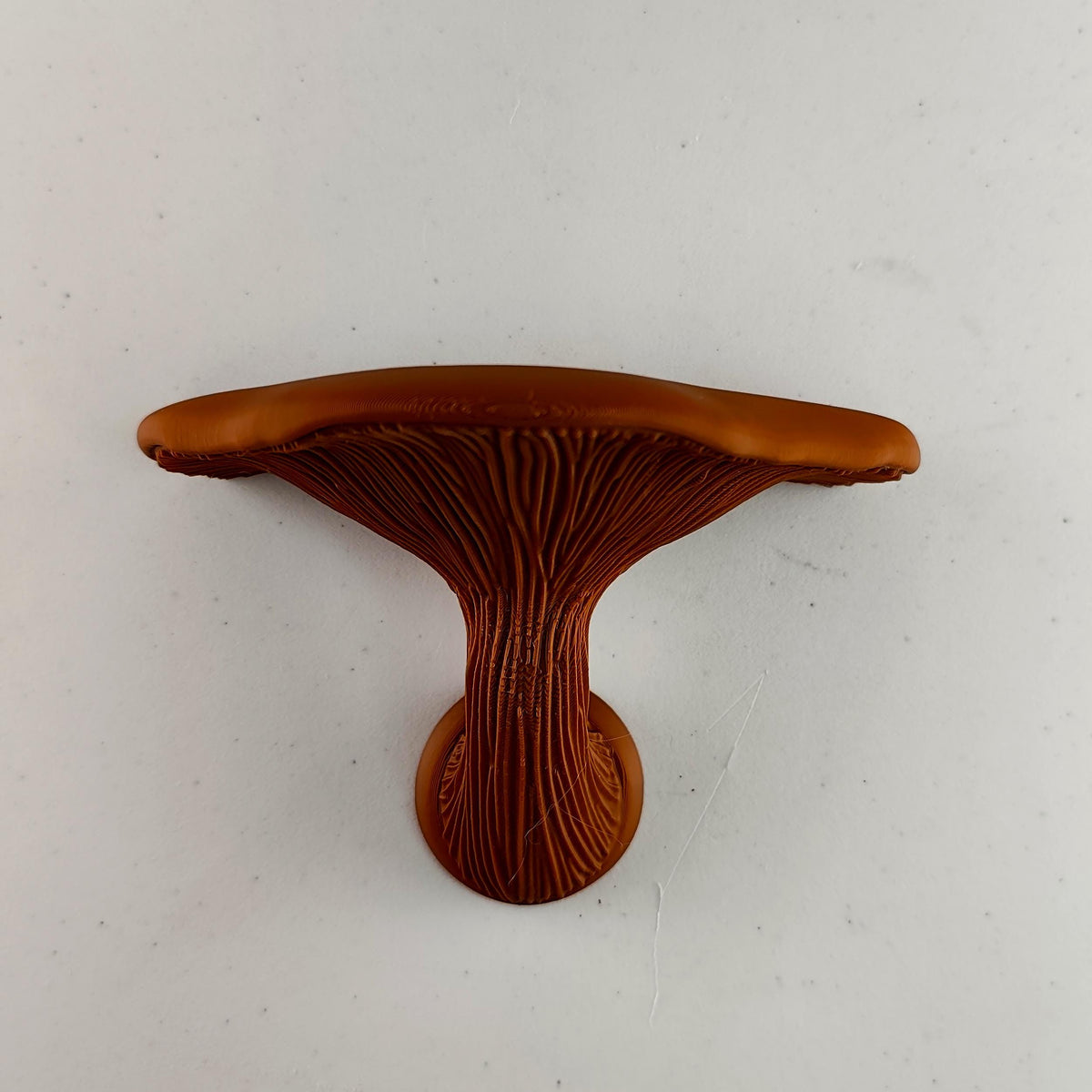 3D printed smooth mushroom wall shelf with rounded cap, sculpted stem and compact floating ledge