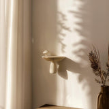 Organic Mushroom Wall Shelf featuring mushroom inspired support beneath a separate raised display ledge