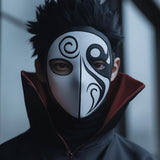 3D printed anime-inspired cosplay mask with a bold spiral pattern across the face.
