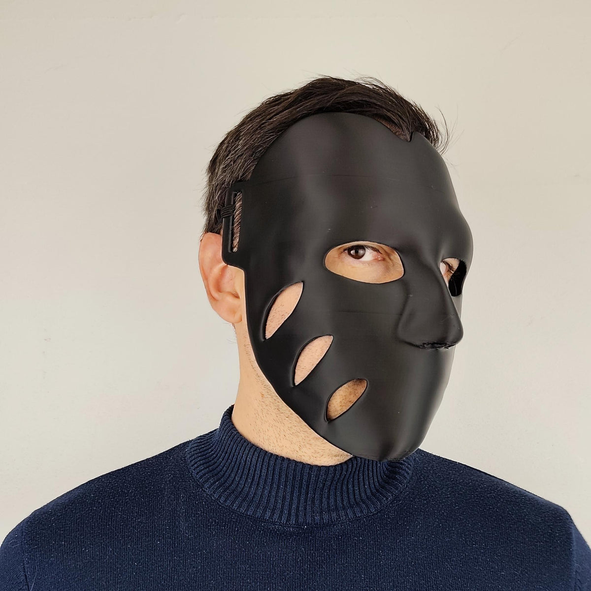 3D printed Black Horror Cosplay Mask with organic cutouts and a sleek and form fitting shape