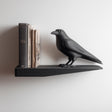 Raven Wall Shelf featuring raven figure integrated at one end of a display ledge