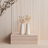 Origami Vase Set of 2 featuring pleated texture, each holding dried grasses