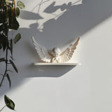 3D printed Angel Wing Wall Shelf with minimalist praying angel figure and wide wings and matte white PLA