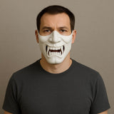 3D printed oni samurai half face mask with fierce fangs and intricate detailing, worn by a man in a dark shirt