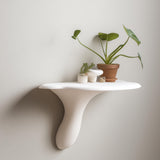 White 3D printed wall shelf inspired by the form of an Artist’s Conk mushroom.