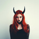 Photo of tall curved demon horns headband with two tall textured horns with an upward curved fantasy silhouette