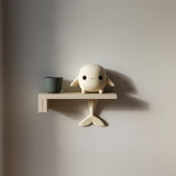 3D printed Whale Character Wall Shelf with small whale character on the ledge and a tail fin support beneath