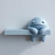 Moody Monster Wall Shelf featuring sad monster character integrated into a display ledge