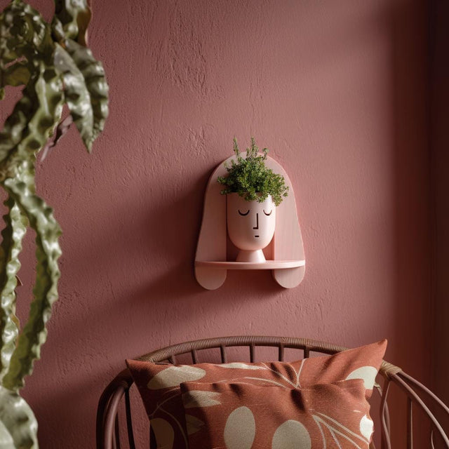 3D printed arched face wall planter featuring a stylized abstract facial design