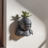 Medieval knight helmet shaped wall planter with a top opening for a small plant